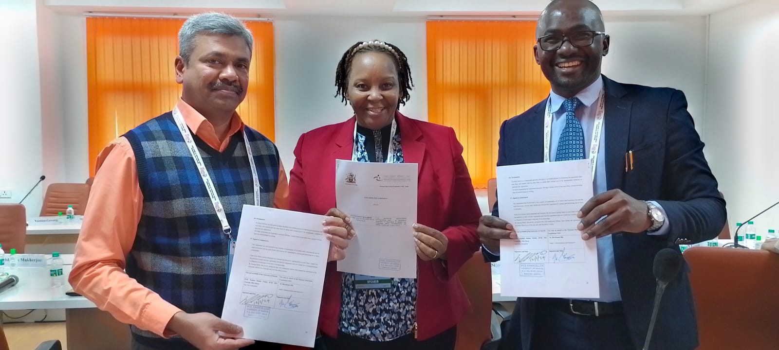 NIF CEO and Head of Administration Scientist Dr. Ravikumar, Prof. Mary Kinoti( Director, Innovation and IPMO) and Dr. OmosaOchwang'i display the signed collaborative agreement in New Delhi, India.