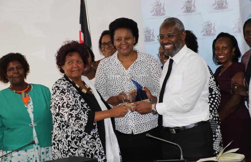 WEE Hub leader Prof Wanjiku Kabira and Prof Mary Kinoti present WEE Hub's Financial Inclusion award to UoN Vice - chancellor Prof Stephen Kiama
