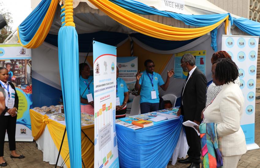 Gideon Muendo explains the WEE Hub's work to UoN Vice Chancellor Prof Stephen Kiama