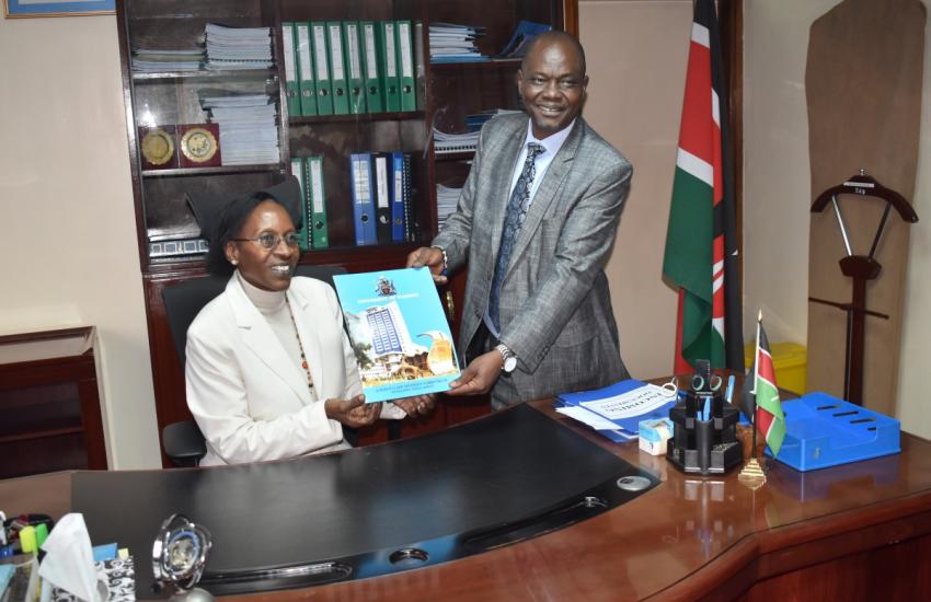 Prof. Mumenya poses for a photo with the outgoing  Dean, Prof. Ayub Gitau
