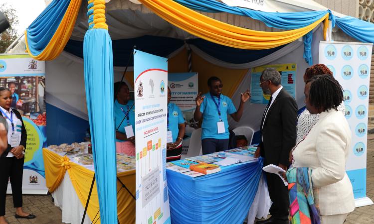 Gideon Muendo explains the WEE Hub's work to UoN Vice Chancellor Prof Stephen Kiama