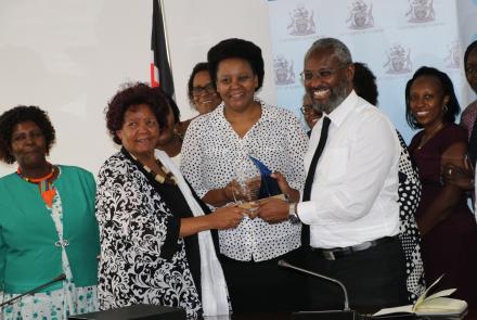 WEE Hub leader Prof Wanjiku Kabira and Prof Mary Kinoti present WEE Hub's Financial Inclusion award to UoN Vice - chancellor Prof Stephen Kiama